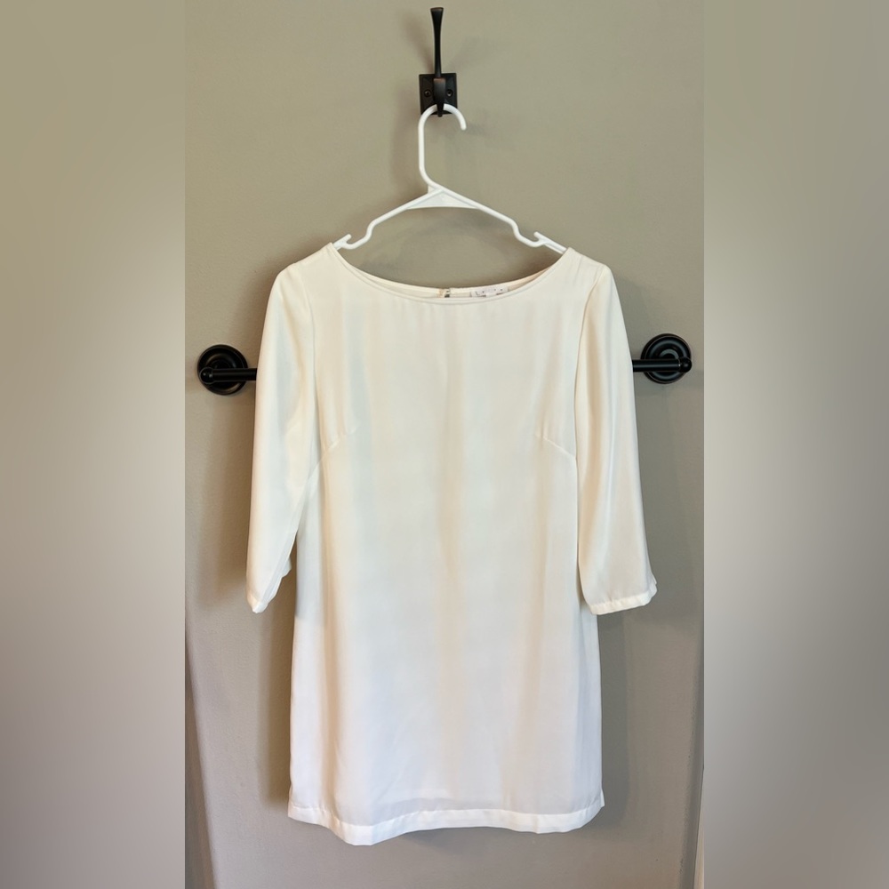 White cocktail dress with 3/4 sleeves. Wore once